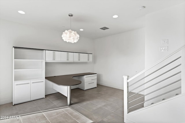 unfurnished office featuring light tile patterned floors