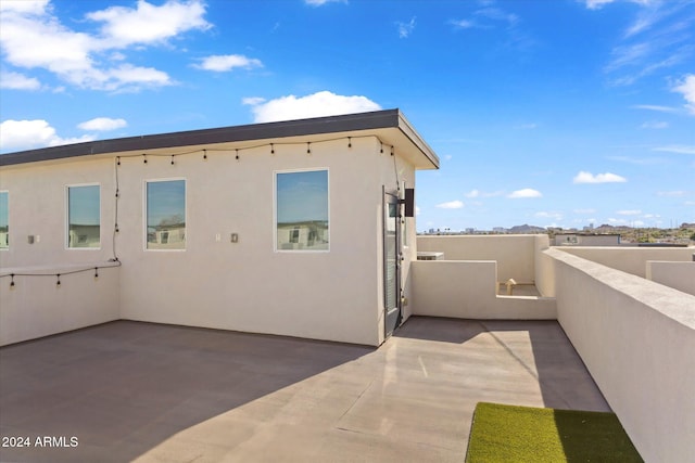 view of side of property with a balcony