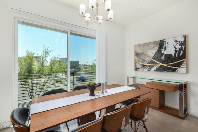 tiled dining area featuring a chandelier