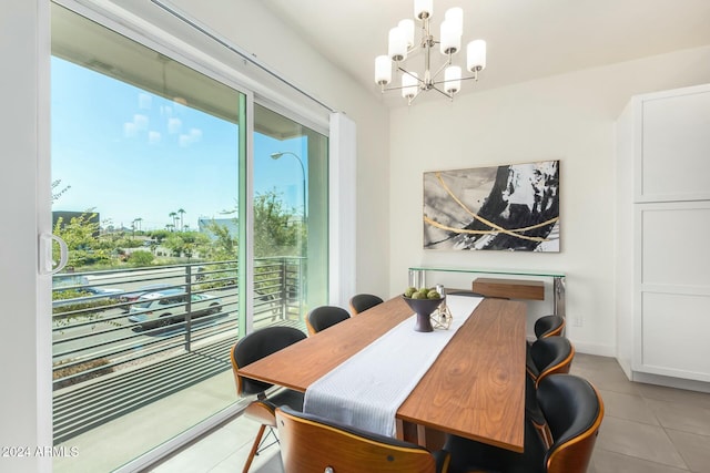 dining space featuring an inviting chandelier and light tile patterned flooring