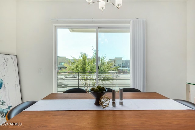 dining area featuring an inviting chandelier