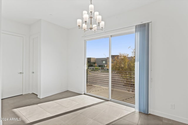 interior space featuring light tile patterned flooring and a chandelier