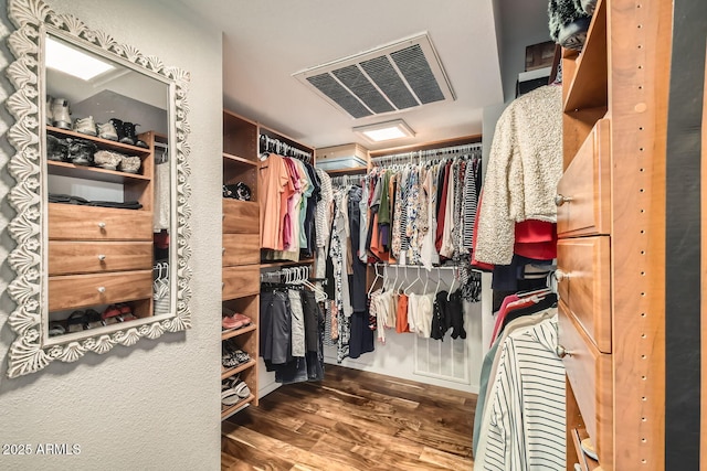 spacious closet with dark hardwood / wood-style floors