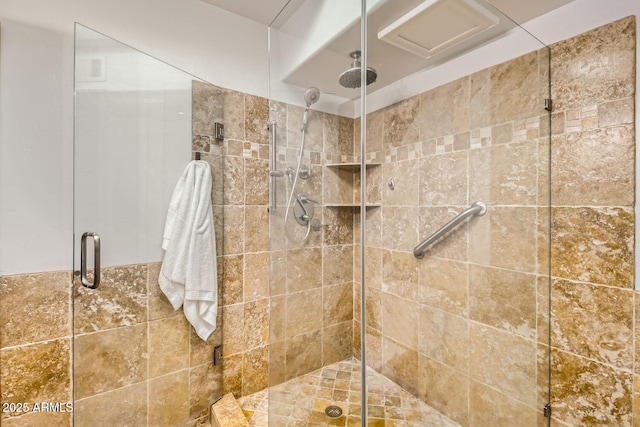 bathroom featuring a shower with door