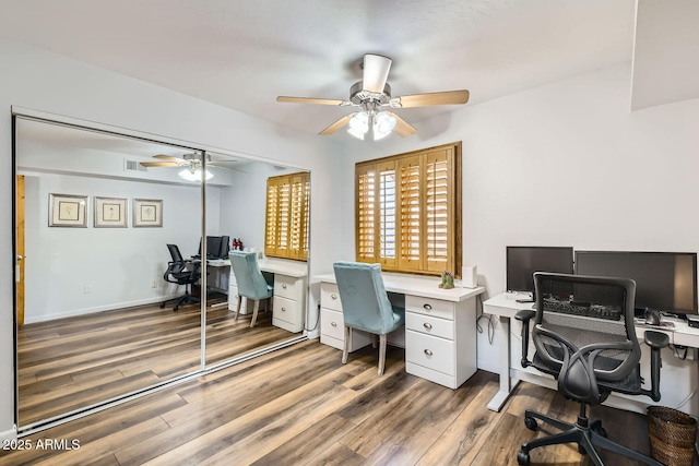 home office featuring wood-type flooring and ceiling fan