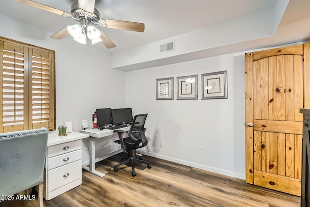 office area with hardwood / wood-style flooring and ceiling fan