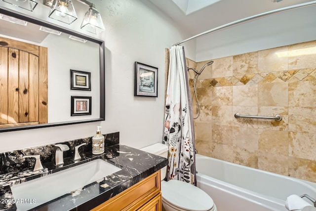 full bathroom featuring vanity, toilet, and shower / tub combo