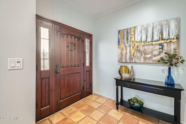 entrance foyer featuring ornamental molding