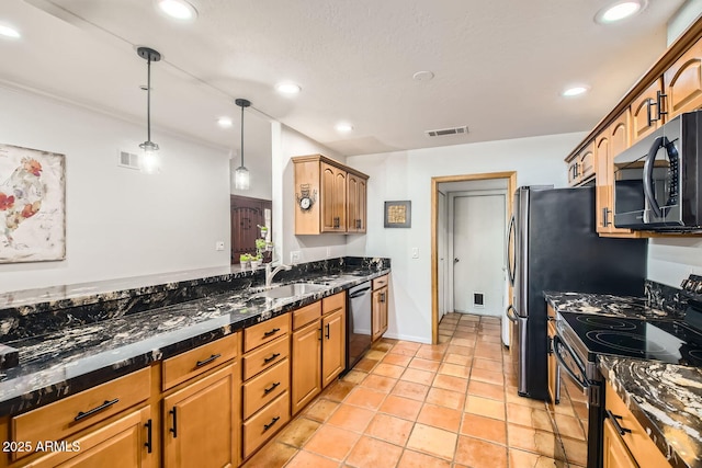 kitchen featuring dishwasher, sink, dark stone counters, hanging light fixtures, and electric stove