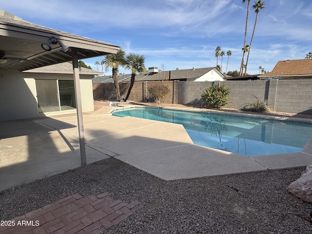 view of swimming pool with a patio area