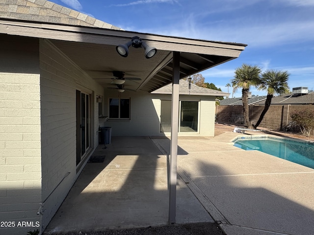 view of pool with a patio and ceiling fan