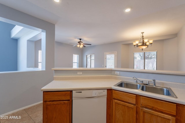 931 S Racine Ln, Gilbert, AZ 85296 - kitchen featuring white dishwasher, light tile patterned flooring, light countertops, a chandelier, and decorative light fixtures