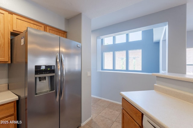 931 S Racine Ln, Gilbert, AZ 85296 - kitchen with stainless steel fridge, light countertops, light tile patterned floors, and dishwashing machine