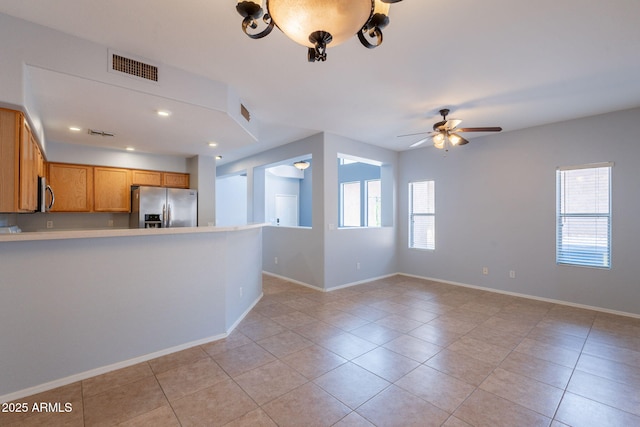 931 S Racine Ln, Gilbert, AZ 85296 - unfurnished living room featuring light tile patterned flooring, a ceiling fan, and recessed lighting