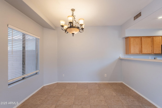 931 S Racine Ln, Gilbert, AZ 85296 - unfurnished dining area with a chandelier and light tile patterned floors