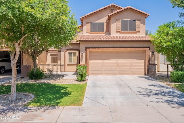 931 S Racine Ln, Gilbert, AZ 85296 - mediterranean / spanish house featuring driveway, an attached garage, stucco siding, and a tiled roof