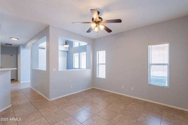 931 S Racine Ln, Gilbert, AZ 85296 - spare room featuring a ceiling fan and light tile patterned floors