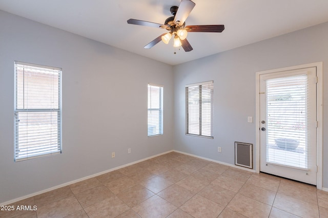 931 S Racine Ln, Gilbert, AZ 85296 - unfurnished room featuring ceiling fan, plenty of natural light, and light tile patterned floors