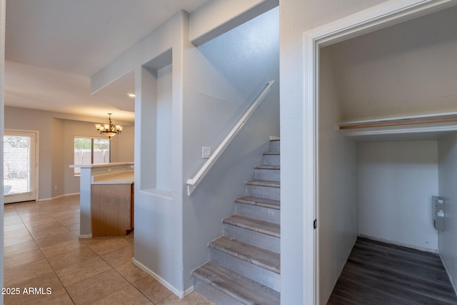 931 S Racine Ln, Gilbert, AZ 85296 - stairs featuring a chandelier and tile patterned flooring