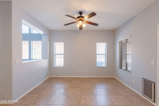 931 S Racine Ln, Gilbert, AZ 85296 - spare room featuring plenty of natural light, ceiling fan, and light tile patterned floors