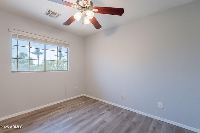 931 S Racine Ln, Gilbert, AZ 85296 - unfurnished room featuring wood finished floors and a ceiling fan