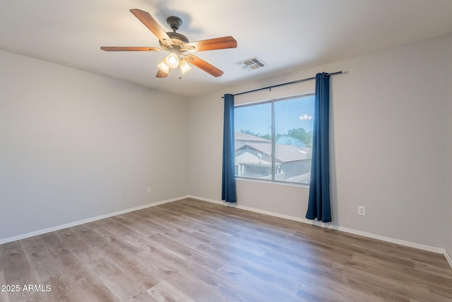 931 S Racine Ln, Gilbert, AZ 85296 - spare room featuring light wood-style floors and a ceiling fan