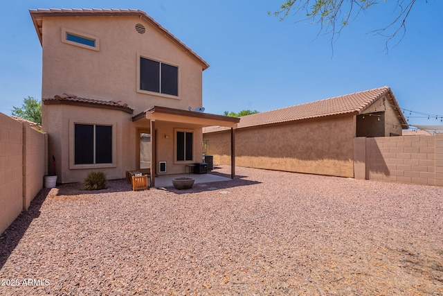 931 S Racine Ln, Gilbert, AZ 85296 - back of property with stucco siding, a patio, a tile roof, and a fenced backyard