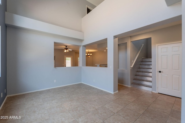 931 S Racine Ln, Gilbert, AZ 85296 - unfurnished room featuring a chandelier, light tile patterned floors, stairway, and ceiling fan