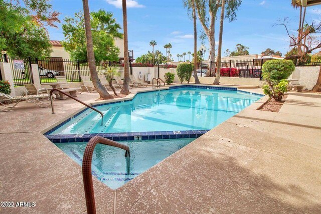 view of swimming pool with a patio area