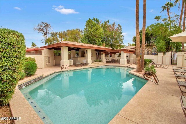 view of swimming pool featuring a patio