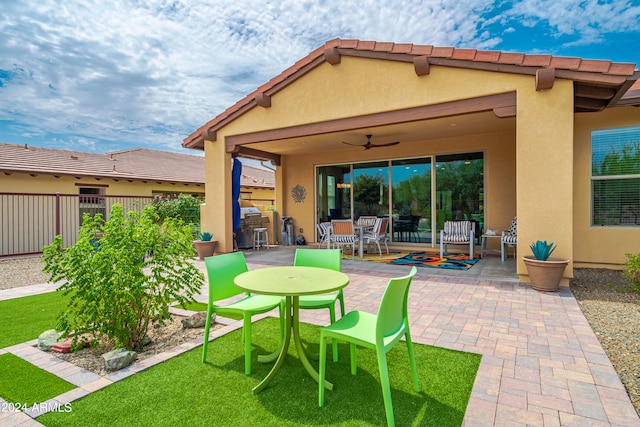 exterior space featuring a patio area and ceiling fan