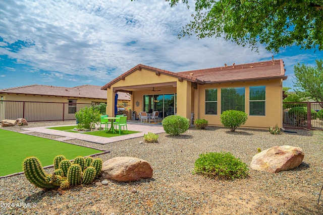 rear view of house with a patio