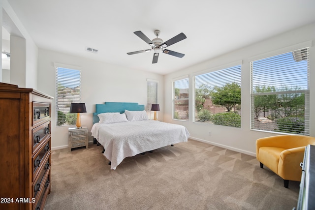 carpeted bedroom featuring ceiling fan