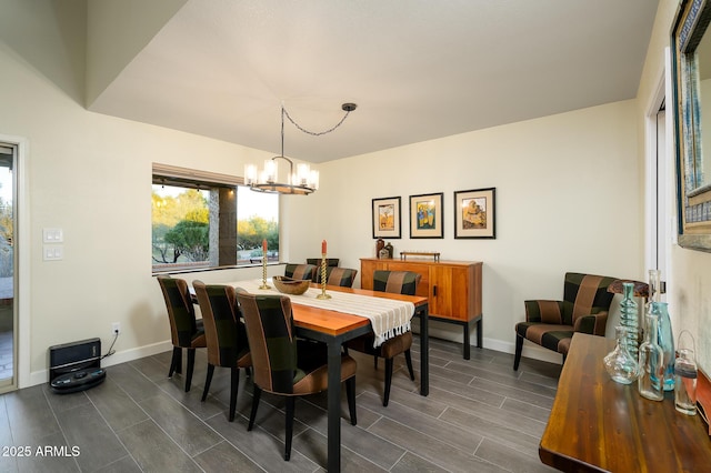 dining space with a notable chandelier