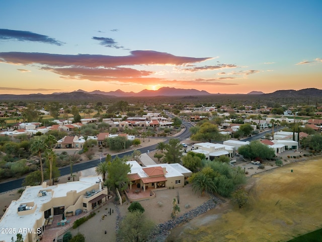 aerial view at dusk with a mountain view