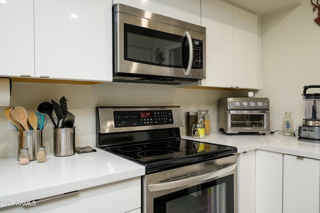 kitchen with white cabinets and stainless steel appliances