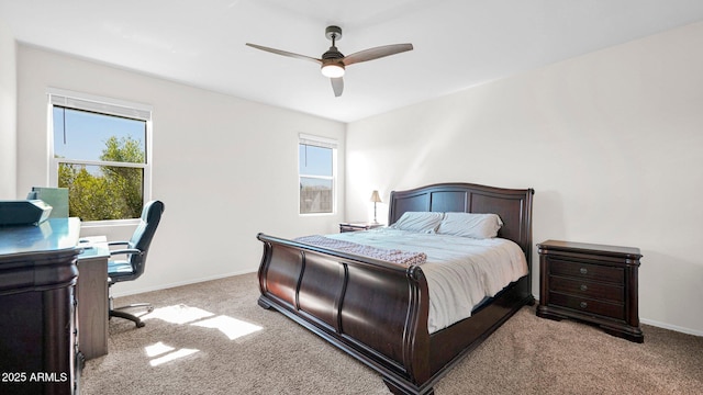 carpeted bedroom featuring ceiling fan and baseboards