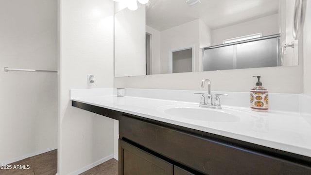 bathroom with visible vents, baseboards, vanity, tile patterned floors, and an enclosed shower