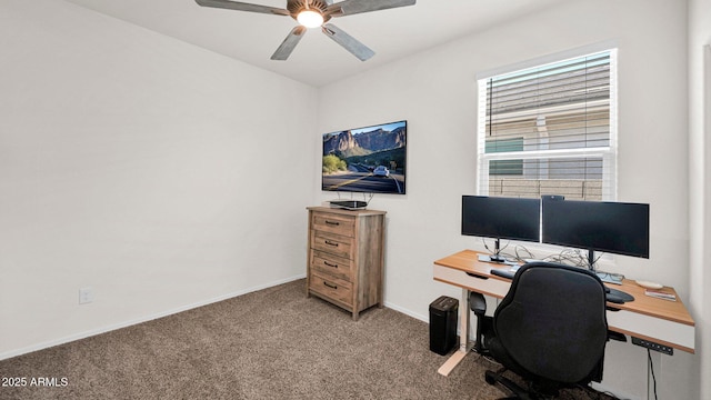 carpeted home office featuring ceiling fan and baseboards