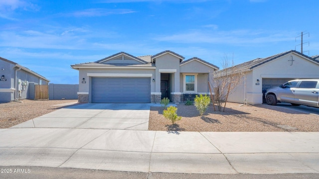 single story home featuring a garage, stone siding, driveway, and stucco siding