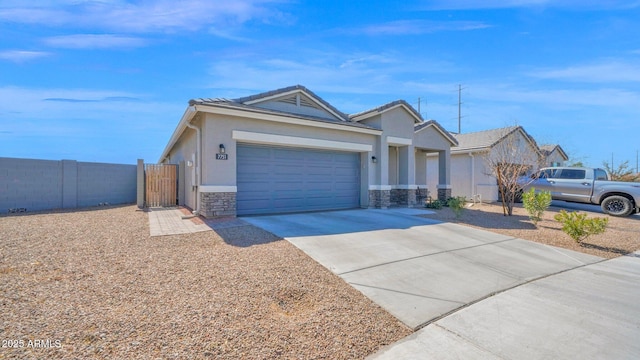 ranch-style home with driveway, stone siding, an attached garage, fence, and stucco siding