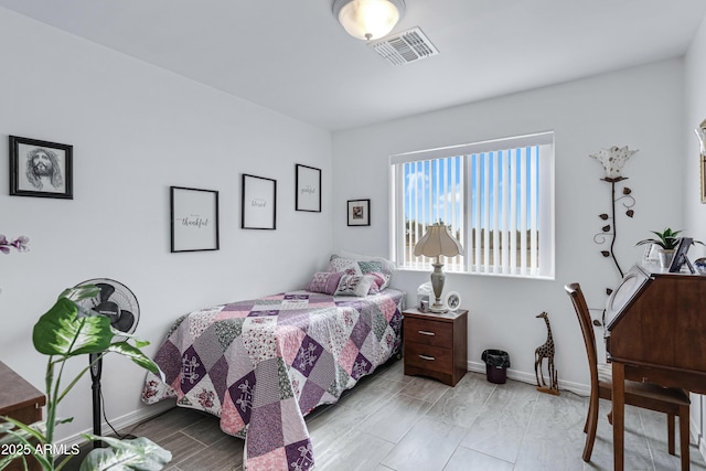 bedroom with light hardwood / wood-style floors