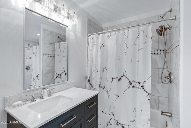 bathroom featuring vanity and shower / bathtub combination with curtain