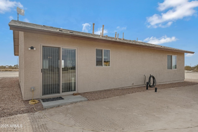 back of house with a patio