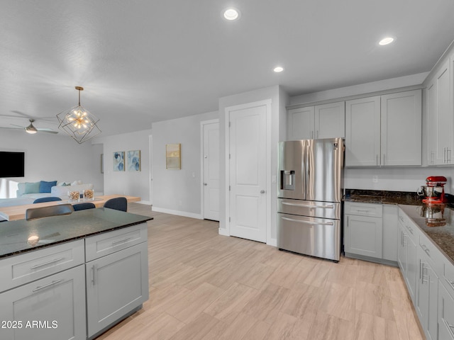2395 S Polaris Way, Flagstaff, AZ 86001 - kitchen featuring stainless steel fridge with ice dispenser, open floor plan, gray cabinets, ceiling fan, and pendant lighting