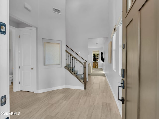 2395 S Polaris Way, Flagstaff, AZ 86001 - foyer with a towering ceiling, stairs, and baseboards