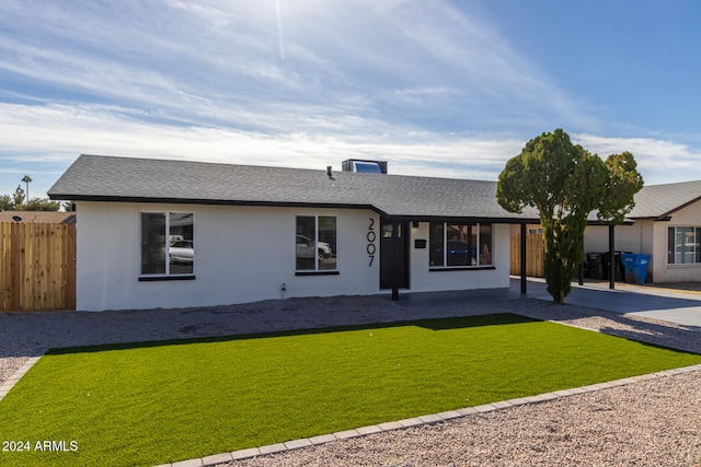 single story home with a front lawn