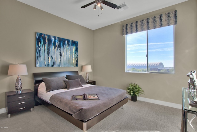 bedroom with light colored carpet and ceiling fan