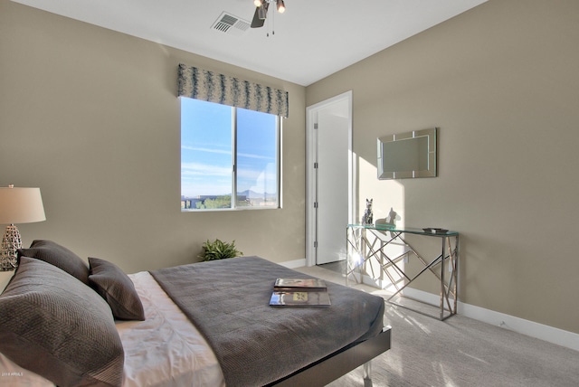 bedroom with light colored carpet and ceiling fan