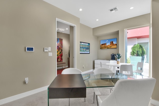 view of carpeted dining area